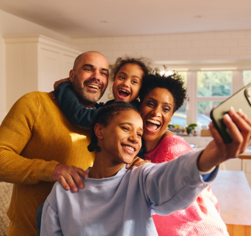A family taking selfie while waiting for HVAC, Plumbing, Electrical & Refrigeration Services in Acton, IN