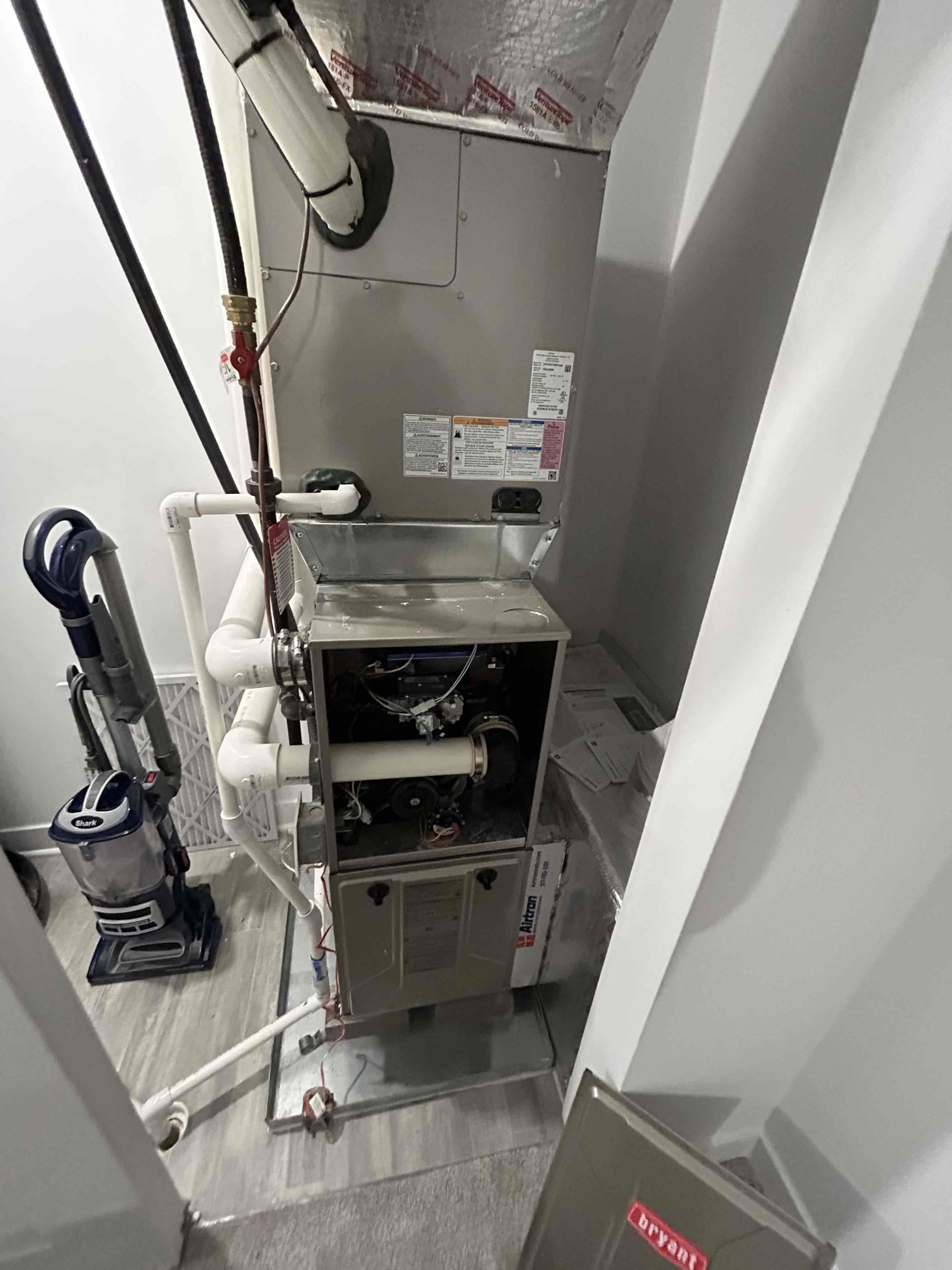 Residential gas furnace inspection during heating repair service in Greenwood Indiana home