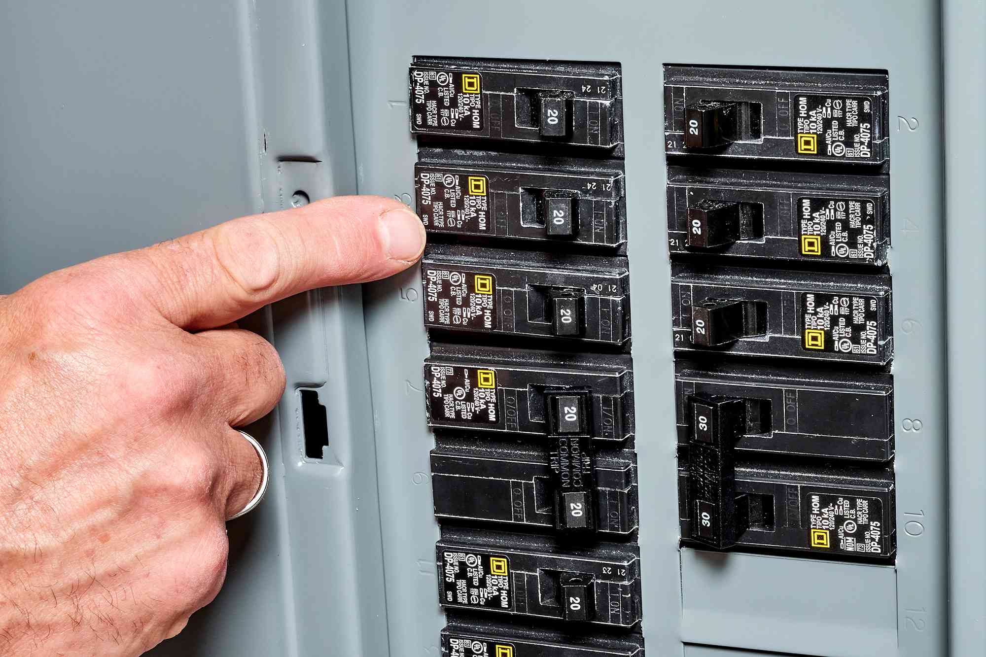 Brewer technician working on circuit breaker in Greenwood home