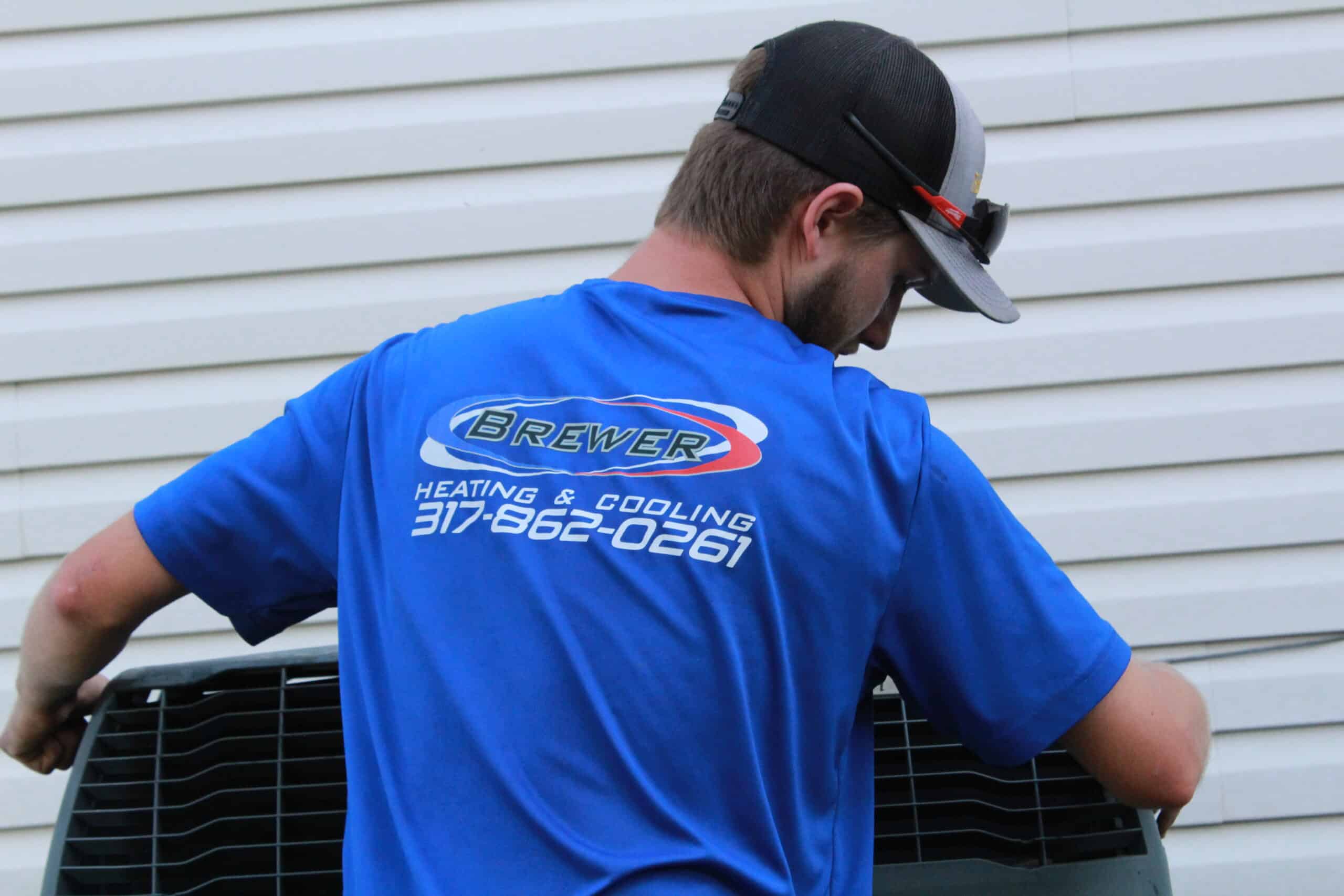 Brewer technician replacing air conditioning unit in Southport Indiana