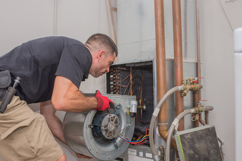 Brewer technician replacing air handler in HVAC system in Franklin Township