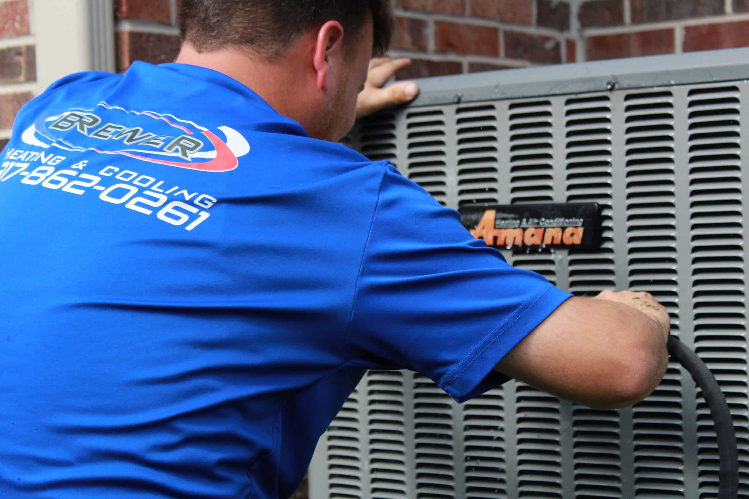 Brewer technician repairing air conditioning unit in Beech Grove Indiana